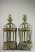A PAIR OF COPPER AND GLASS HANGING LANTERNS 23ins long.