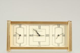 A TIFFANY THREE DIAL CLOCK. 7ins long in a Tiffany box.