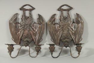 A GOOD PAIR OF BRONZE BAT WALL SCONCES each with two scrolling branches. 10ins long.