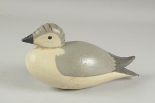 A CARVED WOOD DECOY DUCK. 8.5ins long.