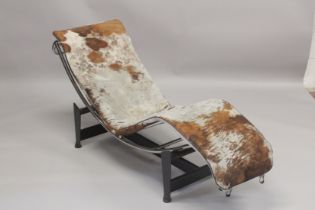 A CHARLOTTE PERRIAND, LE CORBUSIER STYLE CHAISE LONGUE, upholstered in cow hide.