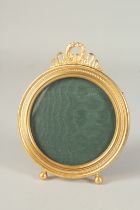 A BOXED ASPREY AND GARRARD ROUND GILDED PHOTOGRAPH FRAME.