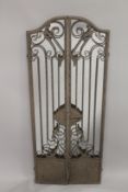 AN IRON FOLDING GATE MIRROR 48ins high.