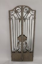 AN IRON FOLDING GATE MIRROR 48ins high.