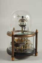 A DECORATIVE FISH CLOCK in a glass dome. 5.5ins high.