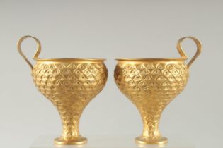 A PAIR OF LALAOUNIS SILVER GILT GOBLETS.