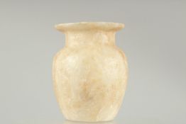 AN EGYPTIAN ALABASTER TUGLET. 5ins high.