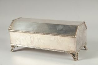 A GOOD SILVER PLATED DESK INK CASKET with rising top and fitted interior. 9ins long.