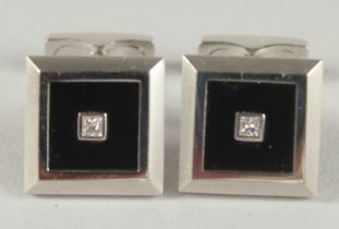 A PAIR OF 18CT WHITE GOLD DIAMOND AND ONYX CUFF LINKS.