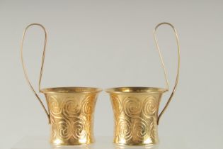 A PAIR OF LALAOUNIS SILVER GILT PUNCH CUPS.
