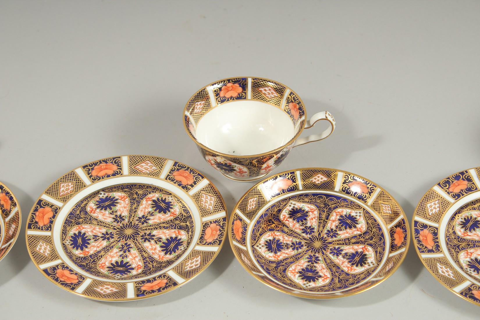 THREE ROYAL CROWN DERBY TEA CUPS, SAUCERS AND SIDE PLATES. Pattern no. 1128. - Image 3 of 6