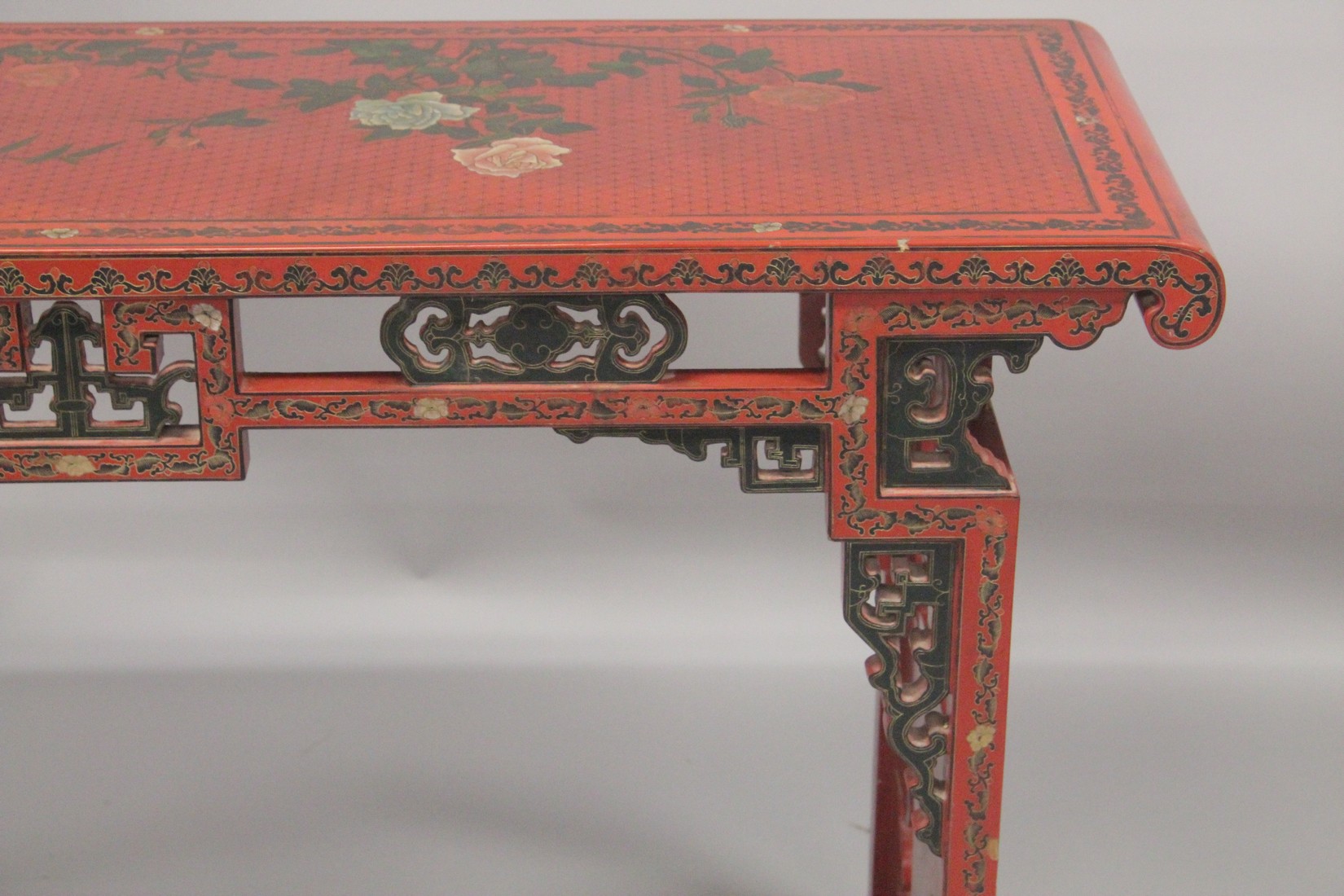 A CHINESE RED LACQUER AND CHINOISERIE DECORATED RECTANGULAR CONSOLE TABLE with a pierced frieze, - Image 3 of 7