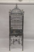 A LARGE IMPRESSIVE PAGODA STYLE BRASS BIRDCAGE AND STAND. 7ft 4ins high x 2ft 2ins wide.