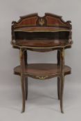 A LARGE FRENCH TWO TIER DESK with a shelf and under tier. 3ft 6ins high.