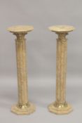 A PAIR OF BEIGE MARBLE OCTAGONAL SHAPED COLUMNS. 3ft 3ins high x 11.5ins wide.