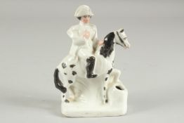 A STAFFORDSHIRE FIGURE OF NAPOLEON on a horse. 5ins high.