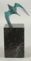 A MODERN FLYING BIRD SCULPTURE on a marble base. 9ins high.