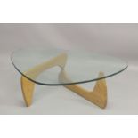 A VITRA NOGUCHI BOOMERANG STYLE COFFEE TABLE with light oak supports.