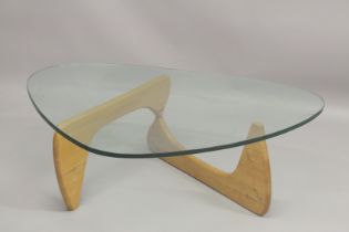A VITRA NOGUCHI BOOMERANG STYLE COFFEE TABLE with light oak supports.