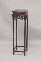 A CHINESE REDWOOD STAND with square top, pierced frieze, on stretchered square legs. 3ft 8.5ins high