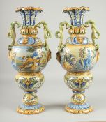 A GOOD LARGE PAIR OF RENAISSANCE STYLE TWO HANDLED VASES painted with classical scenes, masks and