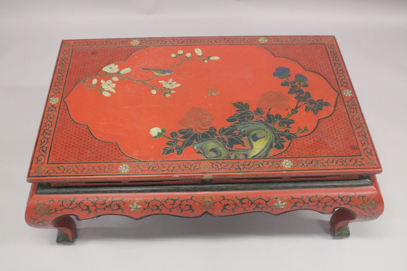 A CHINESE RED LACQUER AND CHINOISERIE DECORATED RECTANGULAR LOW TABLE decorated with flowers, - Image 2 of 4