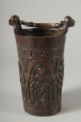 A RARE BRONZE HOLY WATER STOUP the sides cast with religous figures. 7ins high.