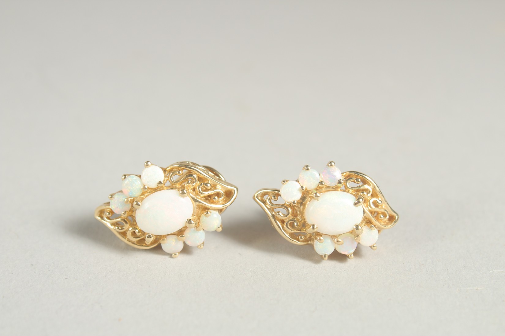 A PAIR OF 14CT GOLD OPAL EARRINGS.