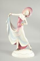 A LARGE DECO PORCELAIN LADY. 19ins high.