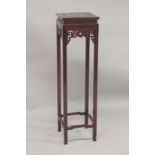 A CHINESE REDWOOD STAND with square top, pierced frieze, on stretchered square legs. 3ft 11ins high