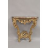 AN 18TH CENTURY ITALIAN GILTWOOD AND MARBLE CONSOLE TABLE, the veriagated marble serpentine top