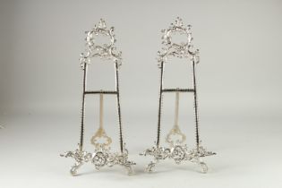 A PAIR OF SILVER PLATED PICTURE EASLES. 20ins high.