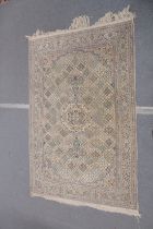 A GOOD PERSIAN NAIRN CARPET beige ground with stylised animals and floral design. 8ft 10ins x 6ft