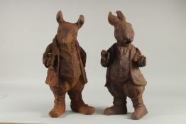 A PAIR OF CAST IRON BEATRIX POTTER FIGURES.