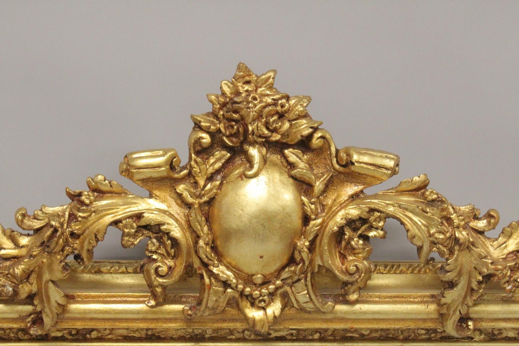 A LARGE GILTWOOD OVER MANTLE MIRROR with scrolls and cupids. 5ft 6ins high, 4ft 8ins wide. - Image 2 of 4