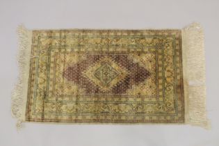 A PERSIAN SILK AND WOOL TEXTILE 41ins x 24ins.