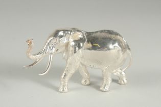 A STIRLING SILVER SOLID CAST ELEPHANT.