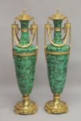 A LARGE AND IMPRESSIVE PAIR OF MALACHITE AND ORMOLU FLOOR STANDING URNS. 4ft 4ins high.