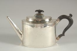 A GEORGE III SILVER OVAL TEA POT with ebony finial and handle. London 1793. Maker: Joseph Scammell.