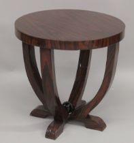 A DARK WOOD ART DECO DESIGN CIRCULAR TABLE. 22ins diameter.