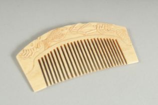 A BONE COMB. 3.75ins long.