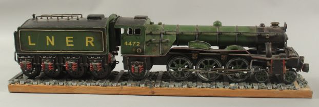 A GOOD TIN PLATE MODEL OF THE FLYING SCOTSMAN. LNER no. 4472 25ins long.