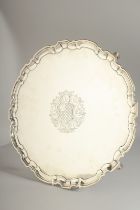 A SUPERB GEORGE II SILVER CIRCULAR SALVER. 13ins diameter with pie crust edge, on four knurled feet,