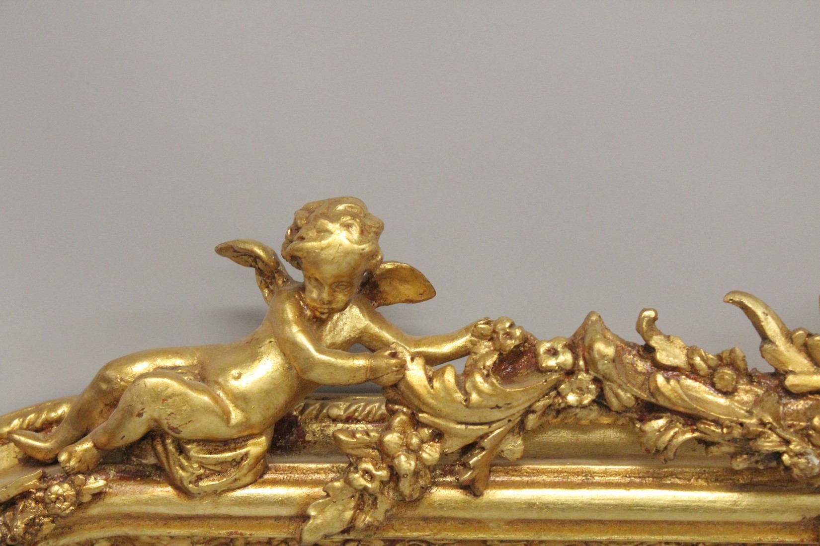 A LARGE GILTWOOD OVER MANTLE MIRROR with scrolls and cupids. 5ft 6ins high, 4ft 8ins wide. - Image 4 of 4
