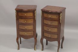 A PAIR OF FRENCH STYLE MAHOGANY WALNUT AND ORMOLU SERPENTINE FRONTED FOUR DRAWER BEDSIDE CHESTS. 2ft