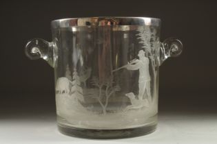 A GOOD GLASS ICE BUCKET engraved with a man and a dog and boar hunting, with plated rim. 7.5ins