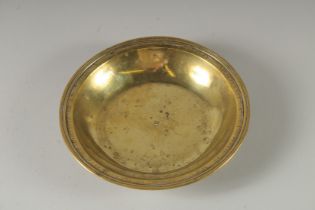 A CIRCULAR BRASS ALMS DISH "MONT CARMEL, 1809". 8.5ins diameter.