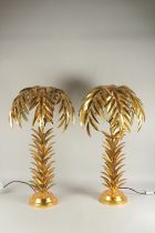 A PAIR OF GILT DECORATED PALM TREE TABLE LAMPS. 2ft 6ins high.