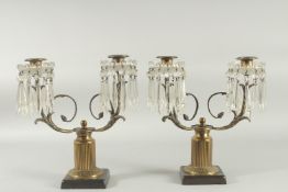 A PAIR OF 19TH CENTURY BRONZE AND CRYSTAL TWO LIGHT CANDELABRA with a pair of scrolling arms and