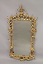 A GOOD 18TH CENTURY CARVED AND GILDED MIRROR with naturalistically carved and pierced frame. 4ft